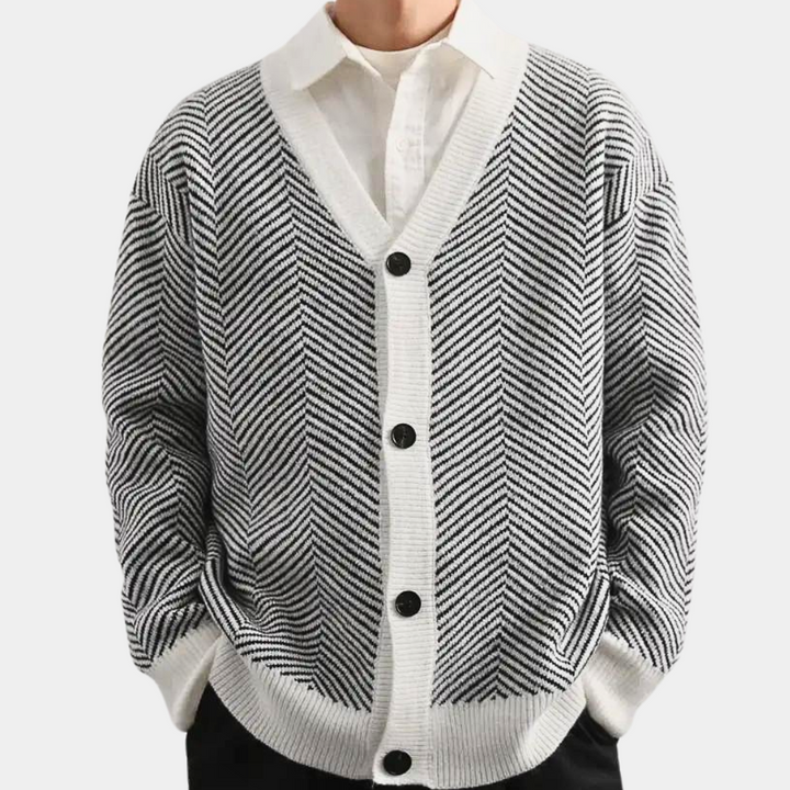 Zwart-wit gebreide trui met visgraatpatroon, lange mouwen en witte kraag. Modieuze herentrui, winterkleding, comfortabele pasvorm.